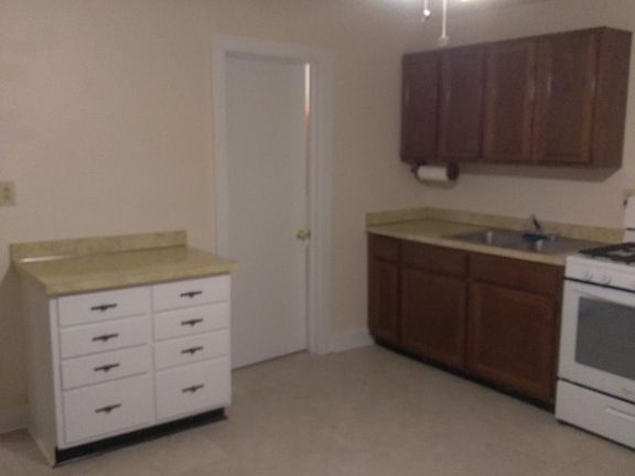 Large kitchen with new tile floor