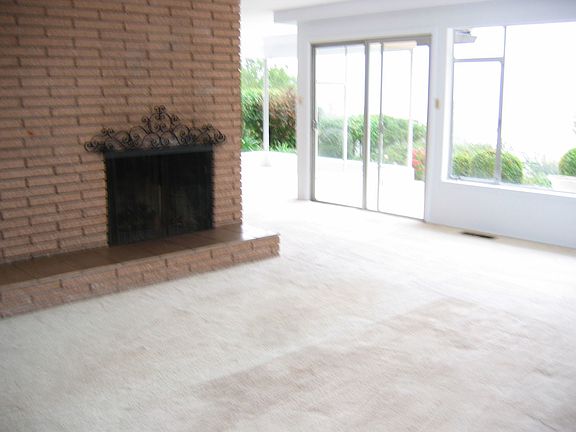 Living Room with fireplace and patio access