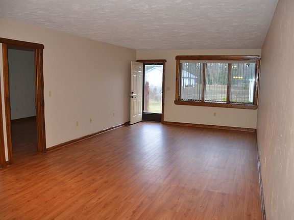 living room with door leading to private outdoor patio