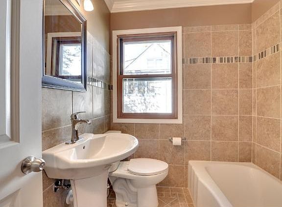 Beautiful new ceramic bath on main level.