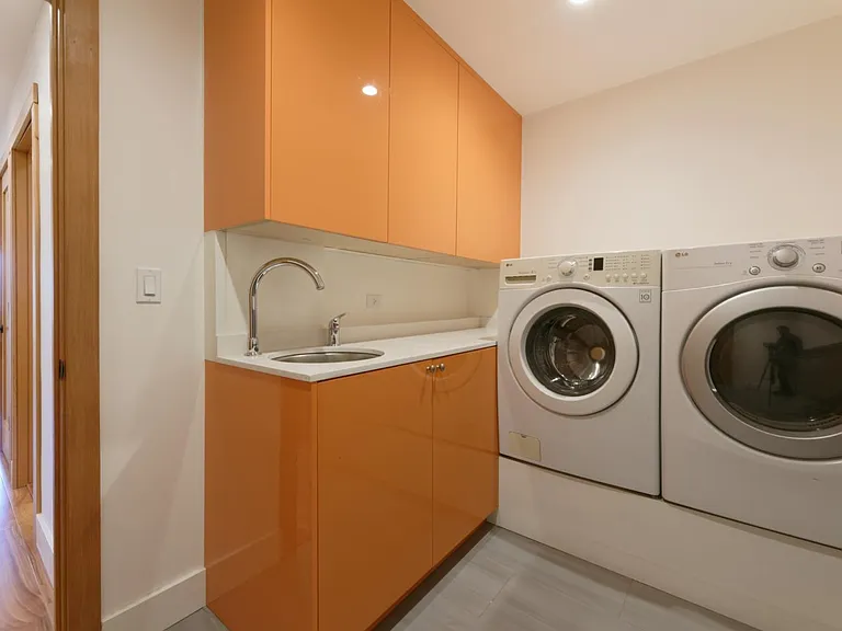 Separate laundry room with sink and storage on first floor (appliances not included with rental)