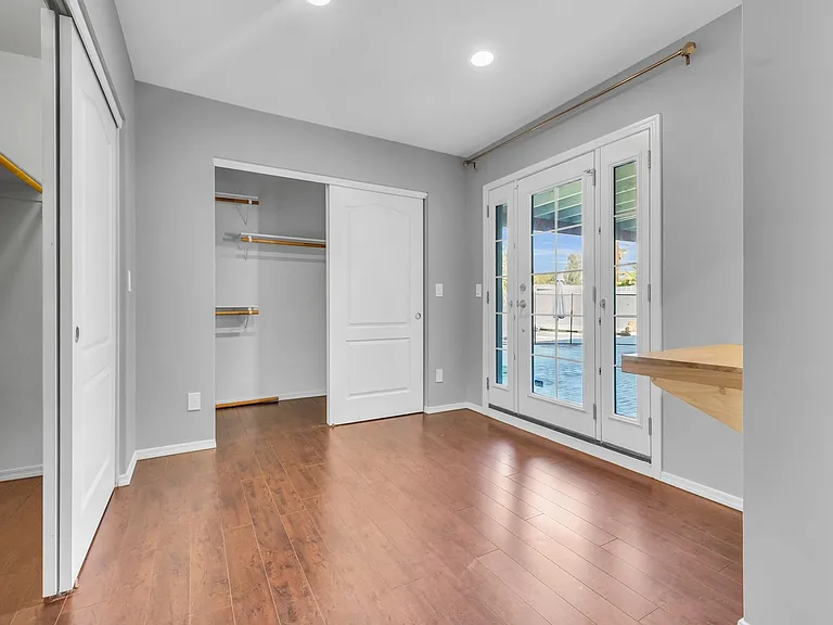 Primary closet room with double closets