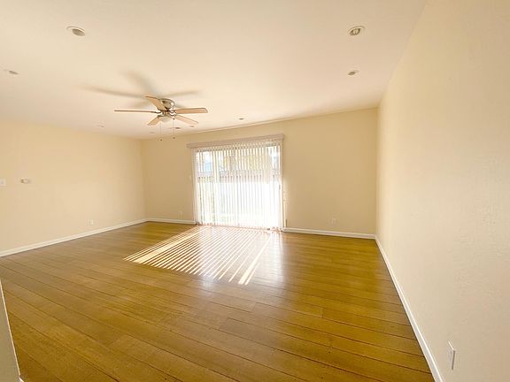 Spacious living room with sliding room access to the backyard