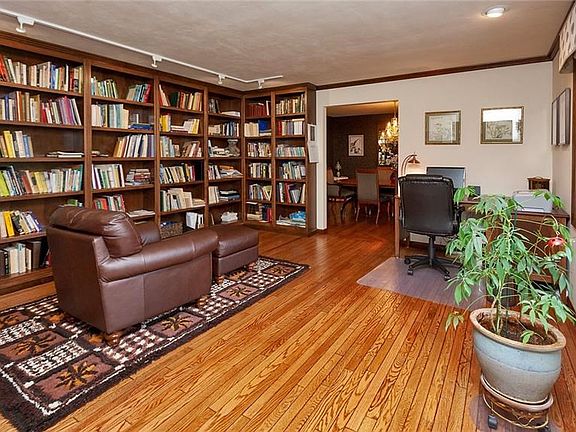 Enjoy a good book or work from home in this spacious study just off the entryway. The hardwood floors have been meticulously mai