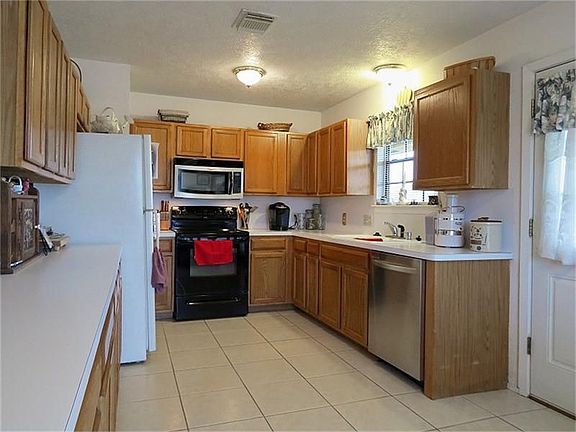 Open kitchen with egress to back porch.
