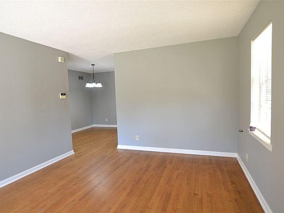 Front entrance looking through the living room into the dining room.