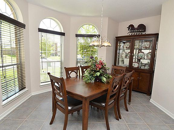  As you enter the home you are greeted by the beautiful formal dining area with elegant bay windows.