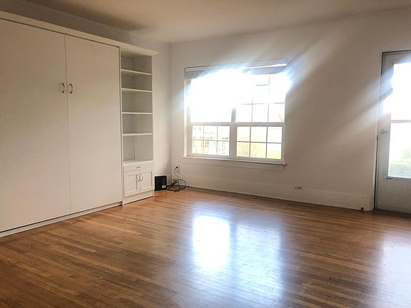 Large living room with Murphy bed that neatly folds into the wall!