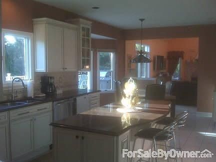 New Custom Kitchen : Granite counter tops, oversize center isle & wine bar