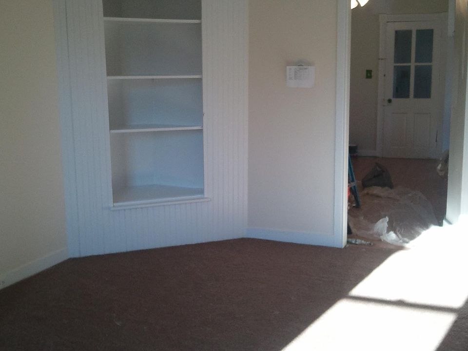 Living room before new paint and flooring