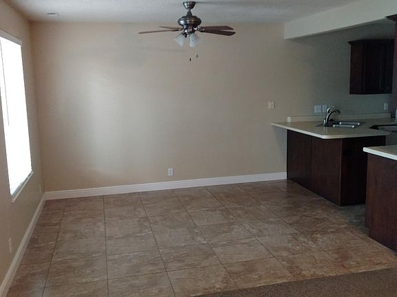Dining area next to living area and kitchen