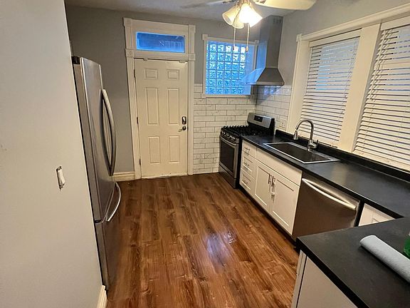 Stainless steel appliances with direct back door access to the shared deck