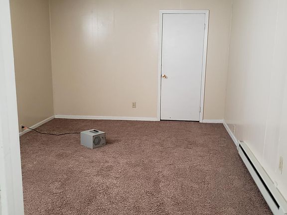 Living room showing door to closet