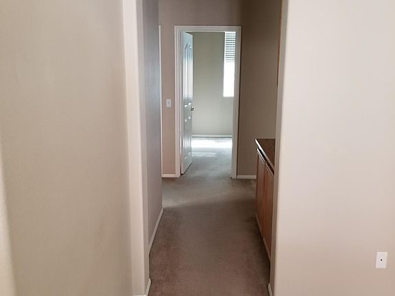 Hallway to the three bedrooms and bathroom.