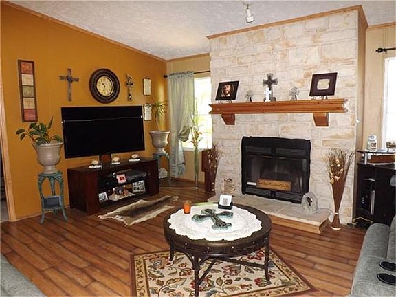 Beautiful laminate wood flooring in the open family room. Custom paint throughout.
