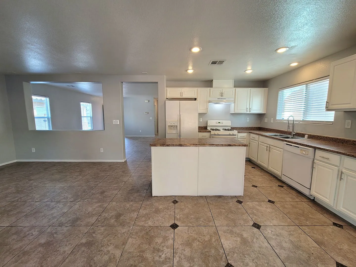 Spacious 3-Bedroom Home with Open Floorplan & Backyard — Photo 3