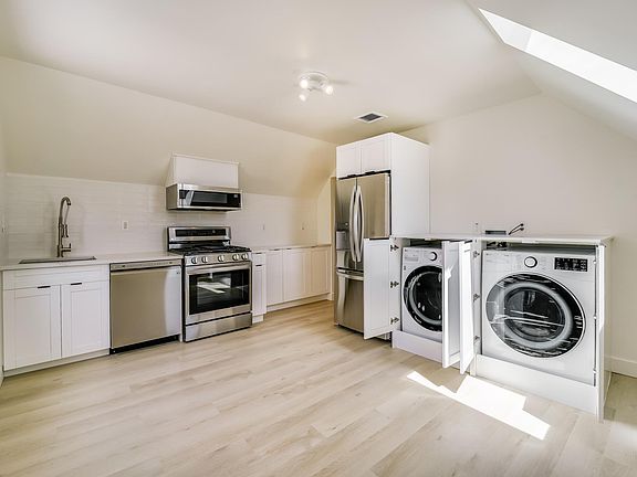 Fully renovated beautiful kitchen/dining with brand new french door fridge, dishwasher, gas stove/airfryer oven, microwave and laundry