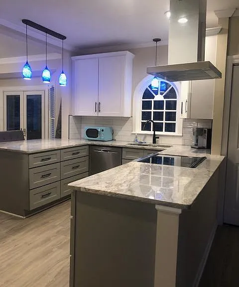 Remodeled kitchen with granite countertops, soft close cabinets and drawers. Lovely view of the fenced in back yard.