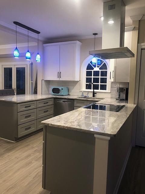 Remodeled kitchen with granite countertops, soft close cabinets and drawers. Lovely view of the fenced in back yard.