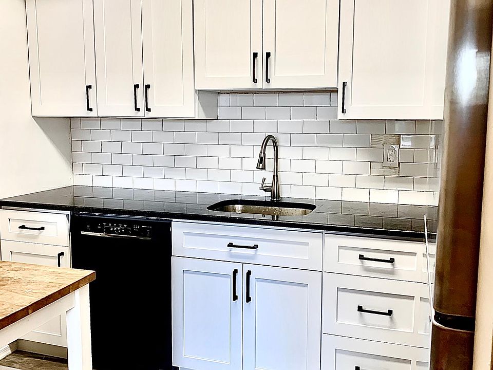 Brand new kitchen with granite counters and stainless appliances