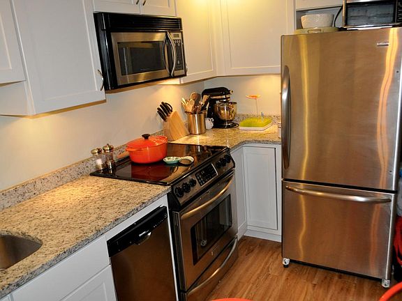 Granite countertops with stainless steel appliances.