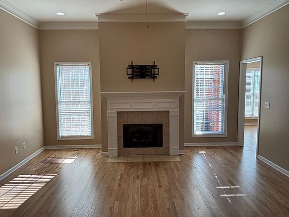 Great room with natural gas logs in fireplace