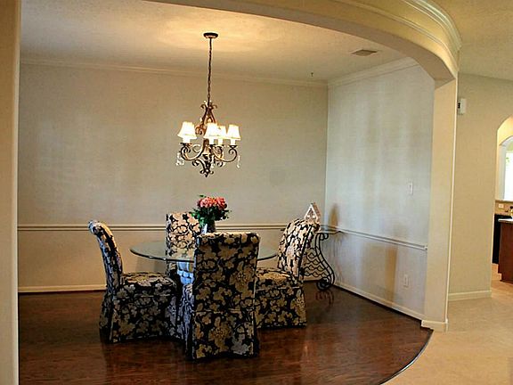 Here's another view of the dining room. Notice the unique architectural design of the "oval-shaded" 