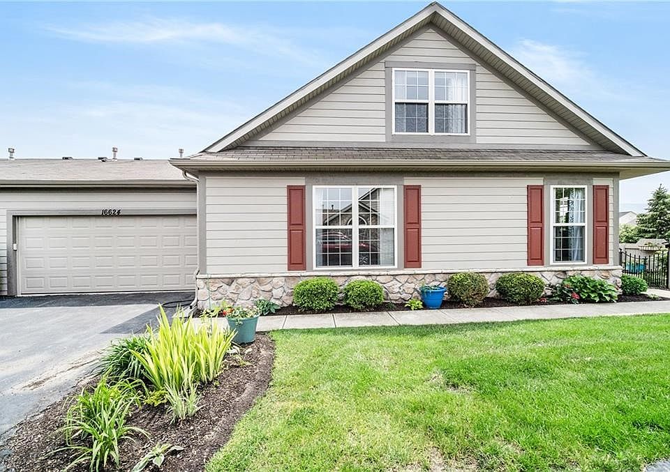 Walk to front door through beautiful outdoor patio