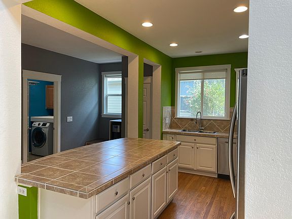 Kitchen, Island, Laundry (entry to garage)