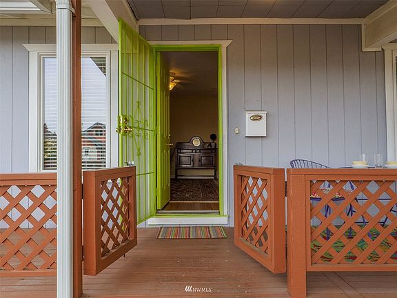 Fully fenced front patio is great for pets and people.