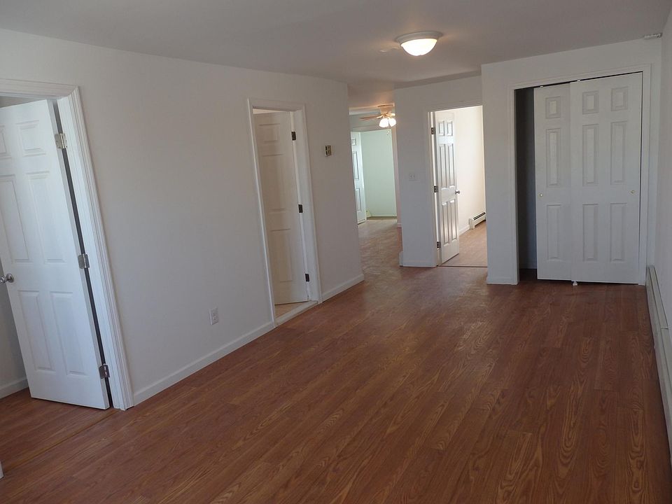 VIEW FROM LIVING ROOM TO KITCHEN, BOTH BEDROOMS AND BATH