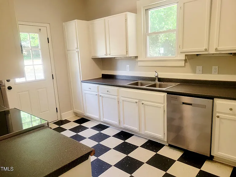 Kitchen all stainless appliances including a dishwasher