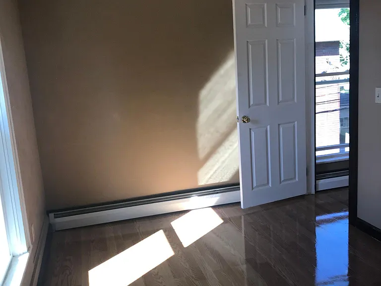 Bedroom is 8 X 10 with overhead light and ceiling fan. Has one window for natural light and a closet.