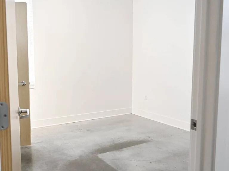 Large bedroom with high ceilings in a unit at The Sawyer.