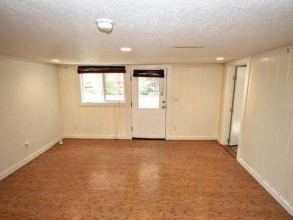 Entrance and living room. Note the picture rail molding for