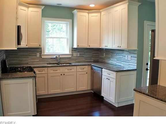 Solid wood cabinetry, Bamboo flooring, granite counters, glass tile back splash and a 4 piece stainless steel appliance package.