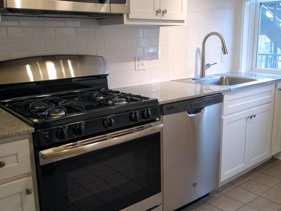 Stainless Steel appliances, white subway tile and brand new cabinets.