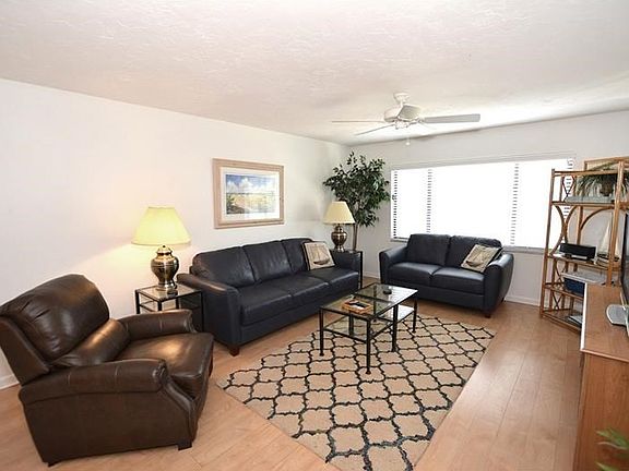 Comfortable living space with laminate flooring for easy care.