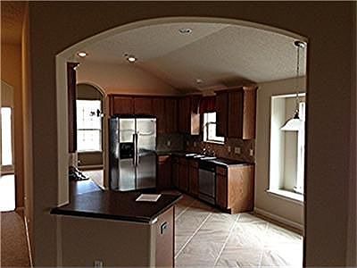 Arch entry into your breakfast and kitchen area.