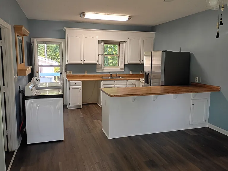 Bright, functional kitchen with room to cook and gather.