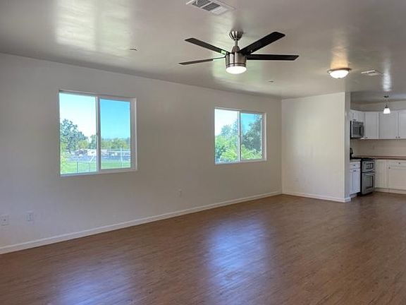 Large open living room with plenty of natural light.