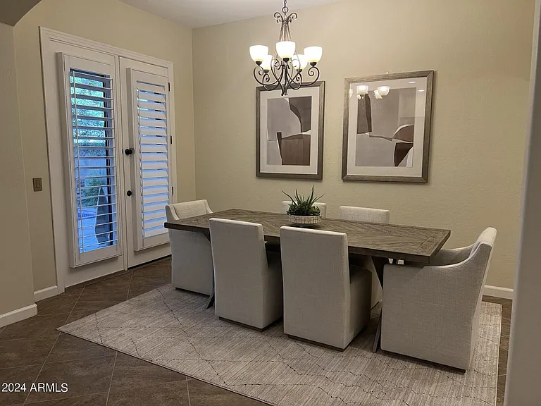 Large dining room with double doors to back patio