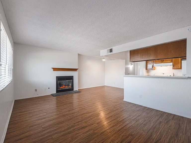 Front Door Leading into Living Space, Dining Area and Kitchen