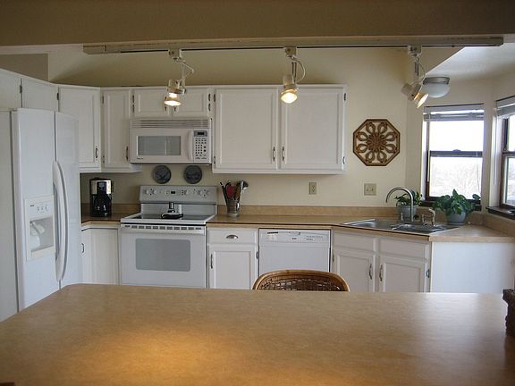 Kitchen has a breakfast bar and pantry