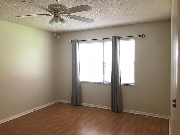 Spacious master bedroom. Window view of the golf course. Ceiling fan