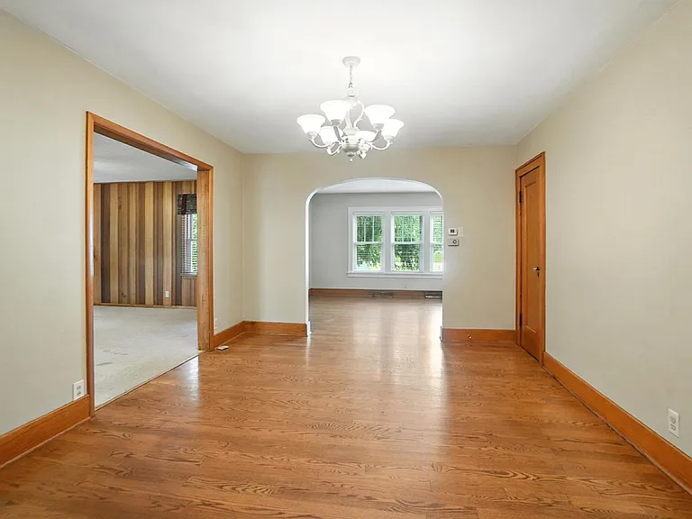 Standing in the laundry room doorway you can see the dining room and the windows are in the living room,