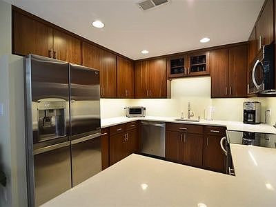 Kitchen with high-end appliances. Kitchen and dining area feature radiant heat. Quartz countertops, custom soft-close cabinetry, and stainless-steel appliances. 

Enjoy morning coffee with lake views and warm floors in winter,