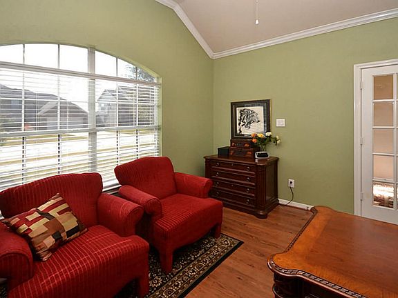 True home office with wood flooring, lots of natural light.