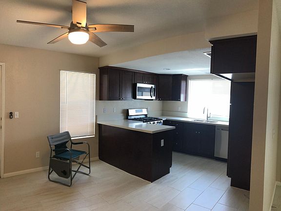 New Kitchen cabinets, countertop and stainless appliances. New tile throughout home