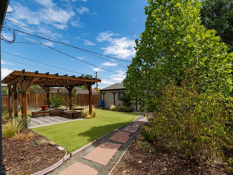 Low maintenance backyard with sitting area, perfect for dogs too. 2 car garage is included with access off alley with adjacent additional parking spot.